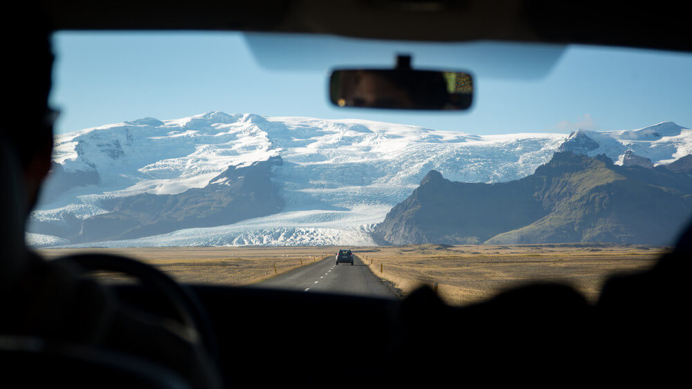 Woman enjoying the majestic views of an scenic drive in Iceland