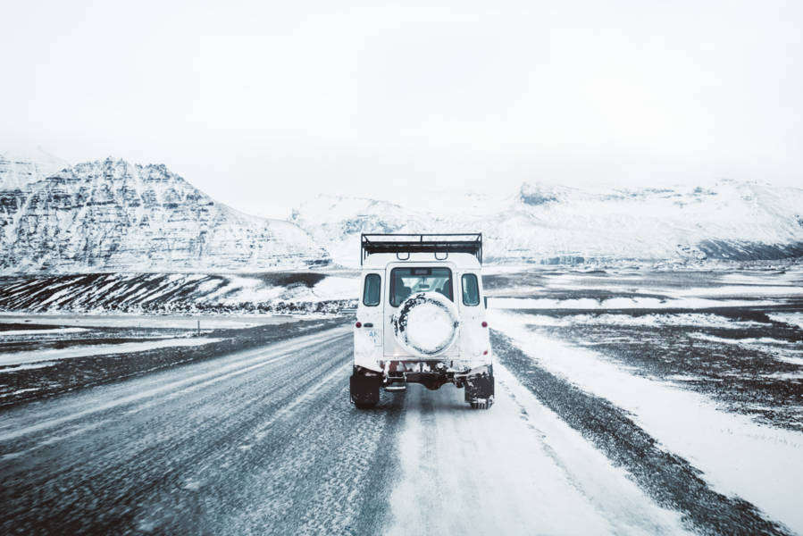 Driver with a jeep driving responsibly in Iceland during the winter time