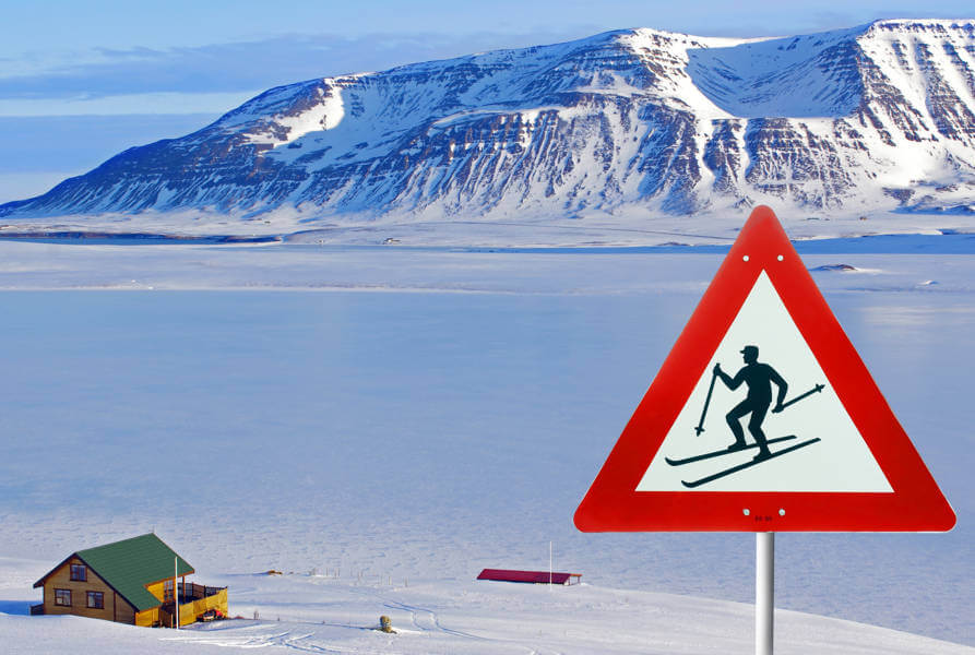 ski sign post on the top of a hill of a ski resort in Iceland